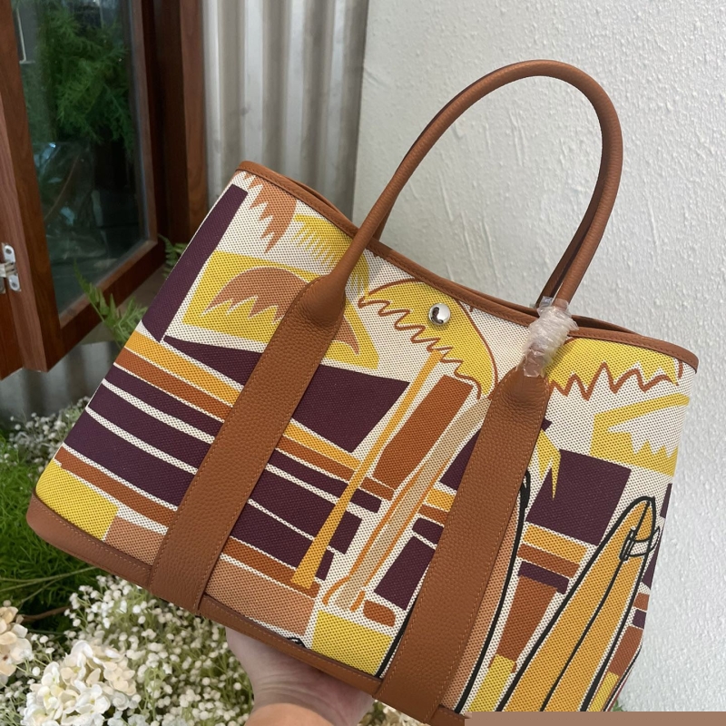 H**mes shopping bags